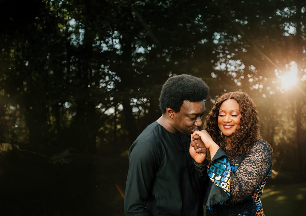 Couple sharing an intimate moment outdoors.